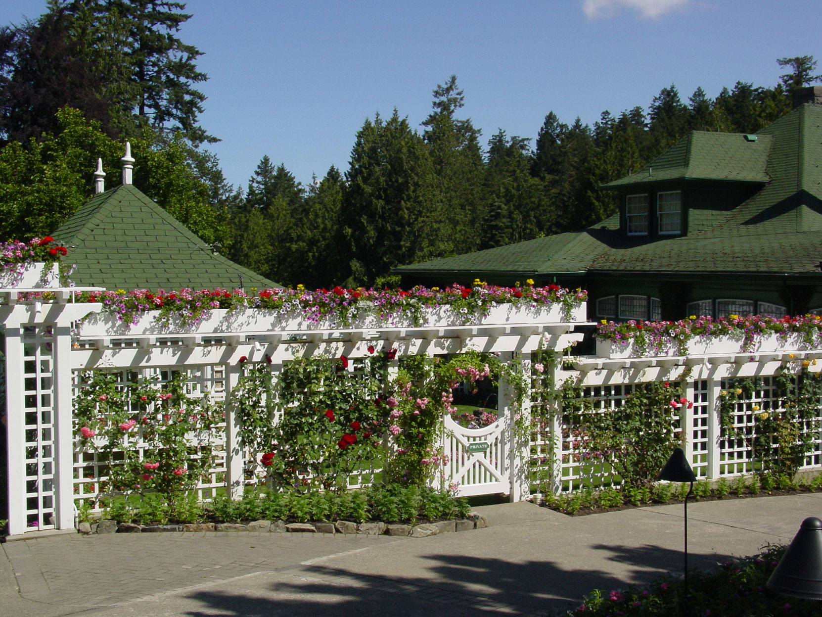 The fence and gate to Jennie Butchart's Private Garden, designed and built in 1920-1921 by architect Samuel Maclure. (photo by Author)