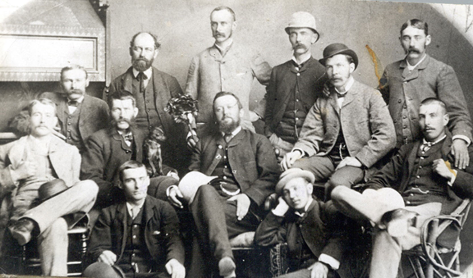 The Owen Sound Board of Trade, circa 1880. Robert Butchart, aged 23, is standing at the extreme right. Standing (left to right): Charles Conklin, Mr. Coates, William Masson, W.B. Stephens, Robert Pim Butchart. Seated (left to right): J.R.Brown, George S. Kilbourn, George I. Inglis, William Brown, Joseph Maughn. Seated on floor (left to right): unidentified, John C. Crane George S. Kilbourn bought shares of the Owen Sound Portland Cement Company in 1895 and remained a shareholder until the company was sold in 1909. Kilbourn also served as the company’s Secretary and Treasurer from 1895 to 1909.) William Masson owned 2 shares of the Owen Sound Portland Cement Company from 1892 to 1896) (photo: Grey Roots Museum and Archives)