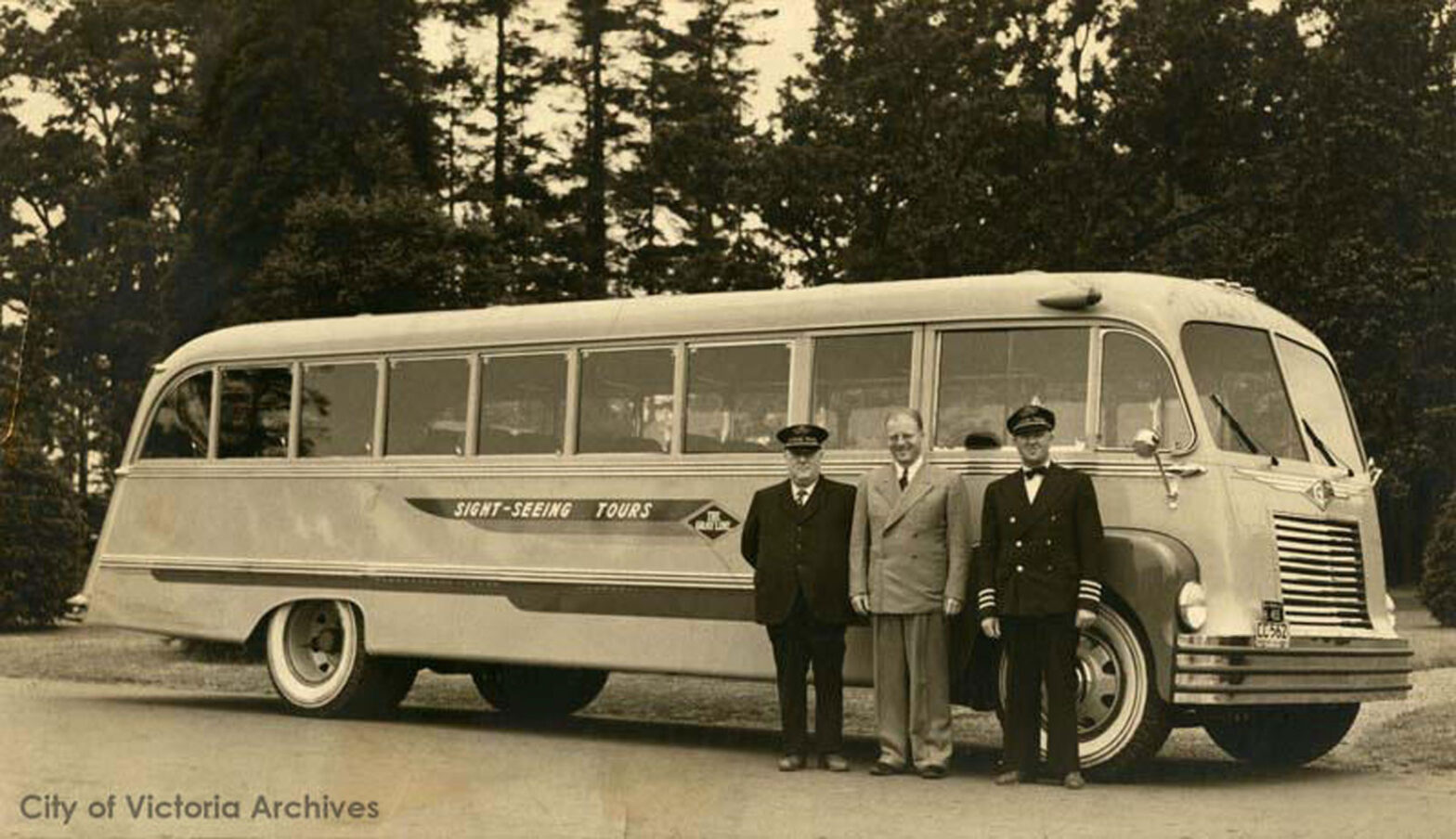 George "Rebel" Mowat (right) with the first converted sightseeing bus received by Gray Line of Victoria, 1940. The other two men in photograph are Angus "Winnipeg" Chilton, Harold Husband (photo: City of Victoria Archives)