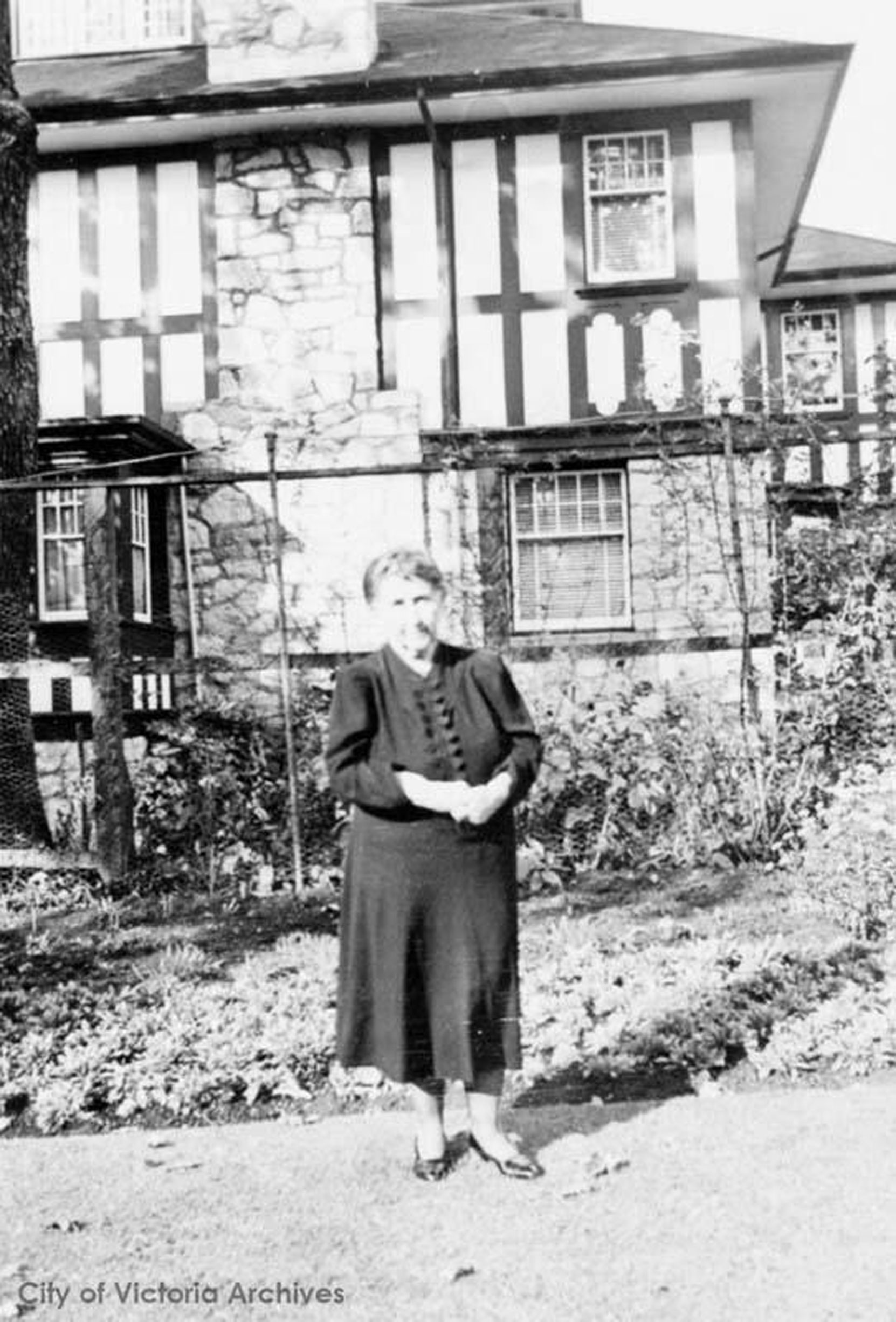 Jennie Butchart, circa 1940. The house is possibly 906 St. Charles Street in Victoria's Rockland district, where Robert and Jennie Butchart moved circa 1939-1940. (City of Victoria Archives photo M00449)