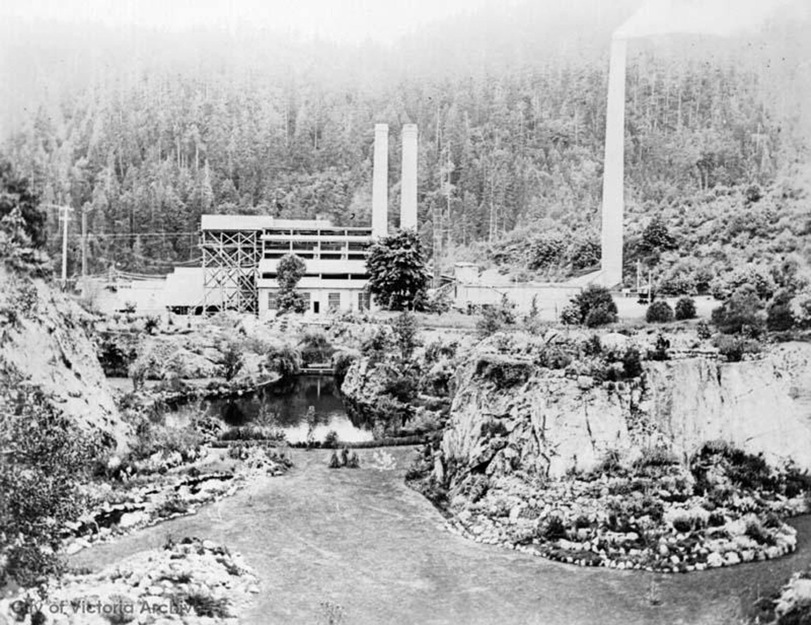 The Vancouver Portland Cement Company plant above the Sunken Garden and the Trout Pond, circa 1910 (City of Victoria Archives photo M00805)