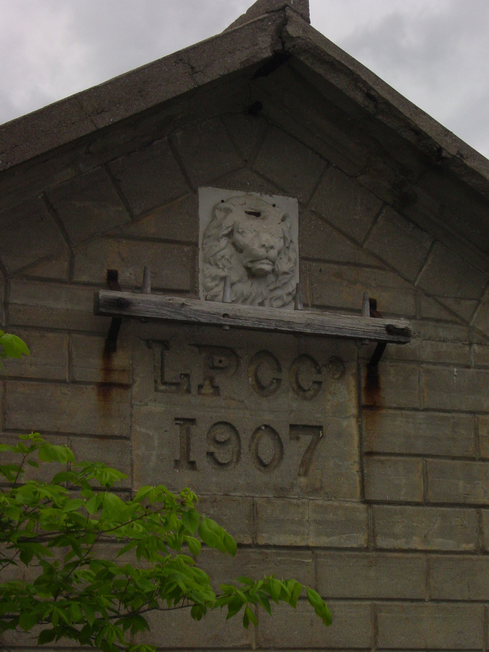 The Lakefield Portland Cement Company lion head logo of the company's pumphouse, built in 1907, on the Otanabee River in Lakefield, Ontario (photo by Author)